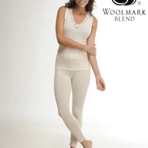 Soft beige woolmark blend top and leggings set, woman smiling with crossed arms, comfortable casual loungewear, high-quality Turkish knitwear, stylish and cozy for everyday wear.