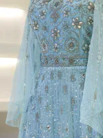 A stunning light blue dress featuring intricate embroidery, sequins, and beadwork, perfect for special occasions and celebrations. Crafted with detailed craftsmanship for a luxurious look.