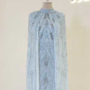 Stunning light blue dress with intricate embroidery and embellishments, displayed on a mannequin. Perfect for special occasions or events.