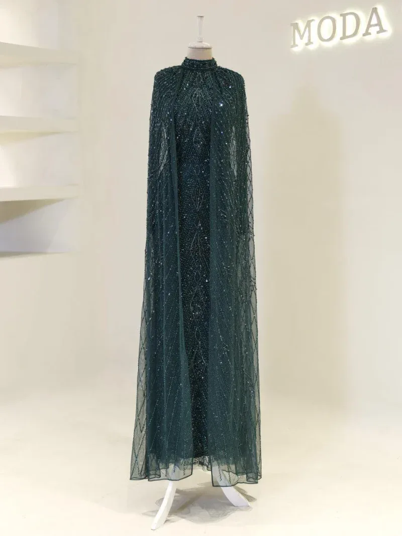 Luxurious dark teal gown adorned with intricate beads and sequins, perfect for formal events and special occasions.
