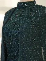 Exquisite black dress adorned with intricate beadwork and sequins, perfect for special occasions and evening wear.