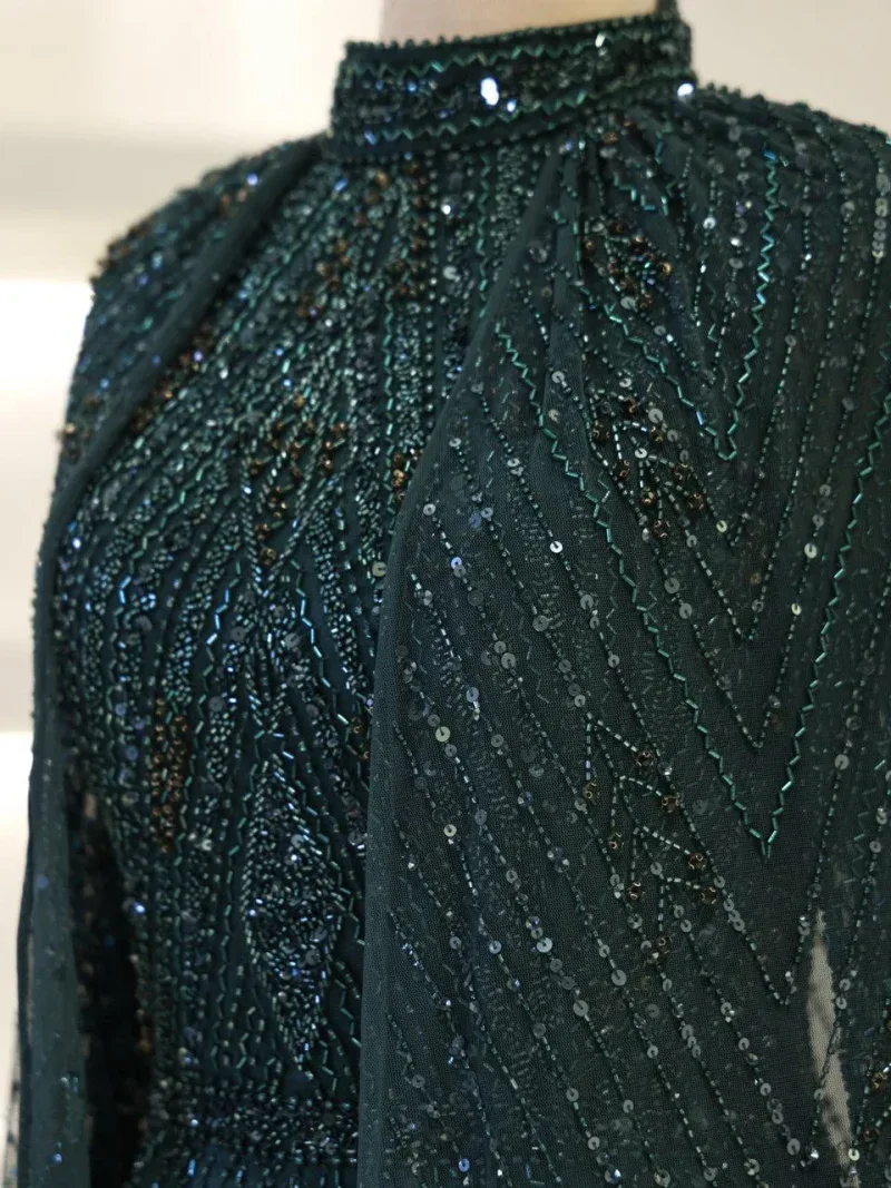 Exquisite black dress adorned with intricate beadwork and sequins, perfect for special occasions and evening wear.