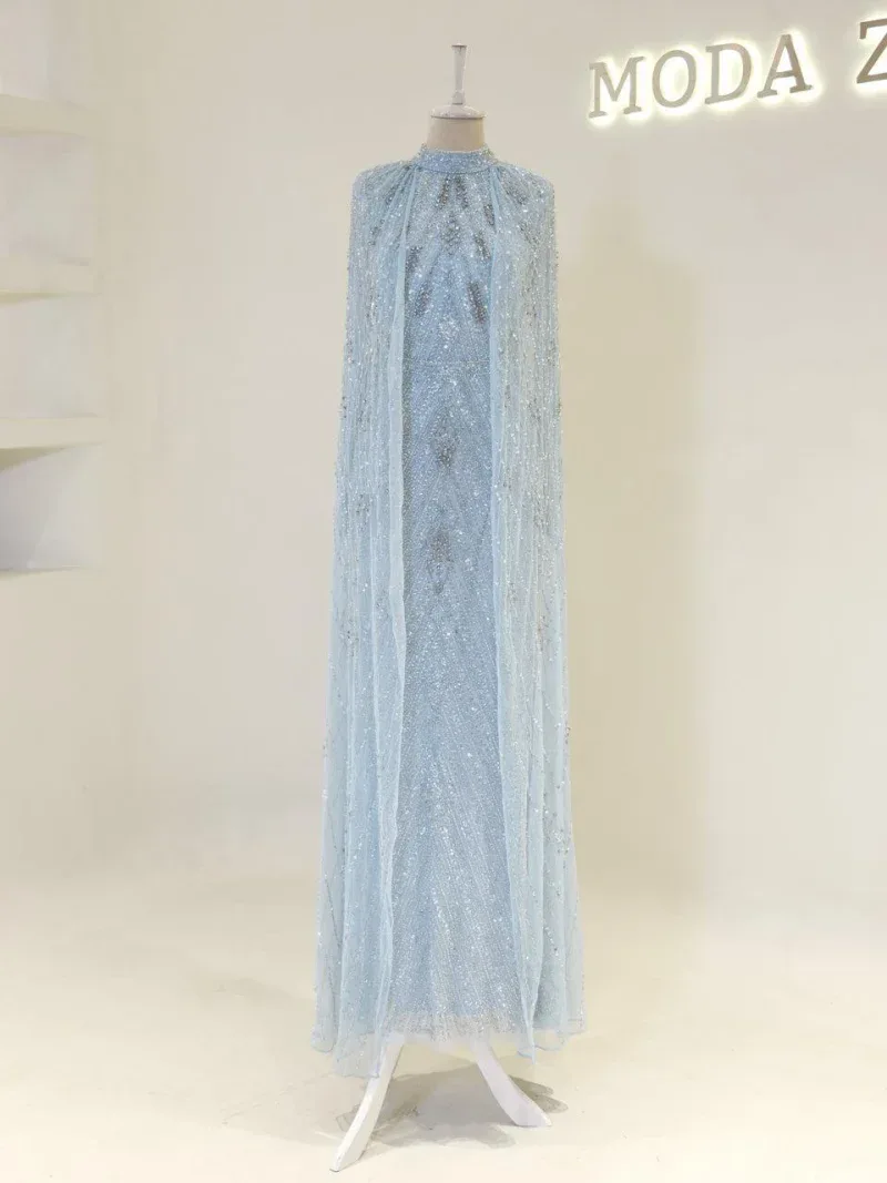 A stunning light blue evening gown adorned with sequins and intricate beadwork, perfect for formal occasions. Showcases detailed craftsmanship with flowing fabric and shimmering embellishments.