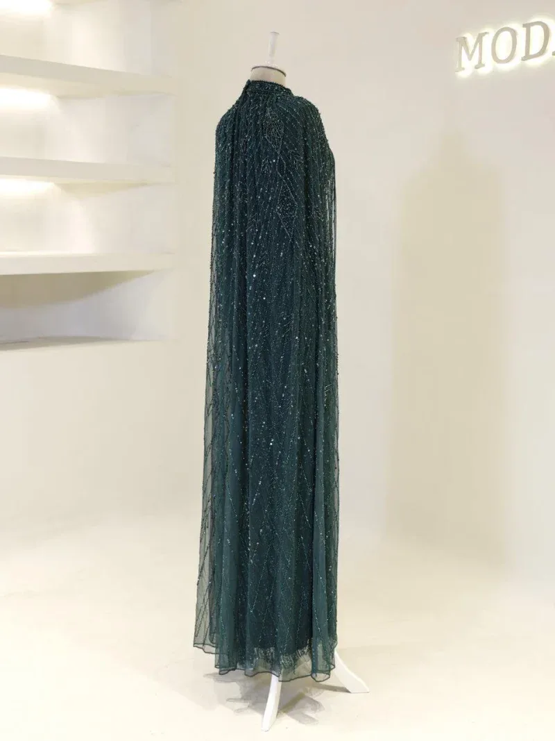 A stunning long evening gown with shimmering sequins and intricate beadwork, perfect for formal occasions or galas. Made from high-quality fabric, offering a luxurious and glamorous look.