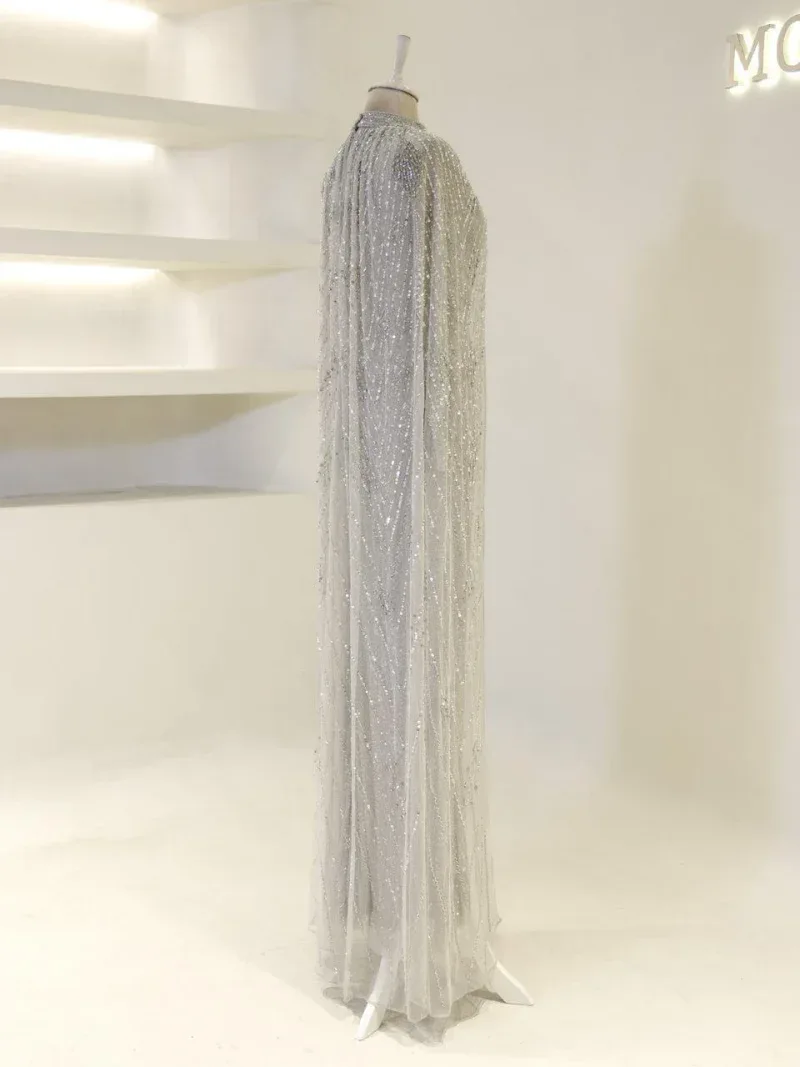 Stunning long silver sequin dress with intricate embellishments, perfect for formal events or special occasions, showcasing elegance and glamour.