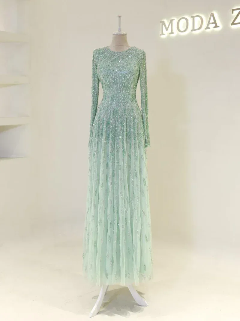 A stunning long gown with intricate sequins, perfect for formal occasions or special events, showcasing luxury fashion from Turkey.