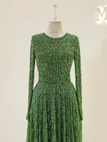 Exquisite green dress adorned with intricate embroidery and sequins, perfect for special occasions or celebrations.