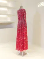 Gorgeous red evening gown featuring intricate beadwork and a flowing tulle skirt, perfect for formal events and special occasions. Crafted with high-quality materials for a luxurious look.