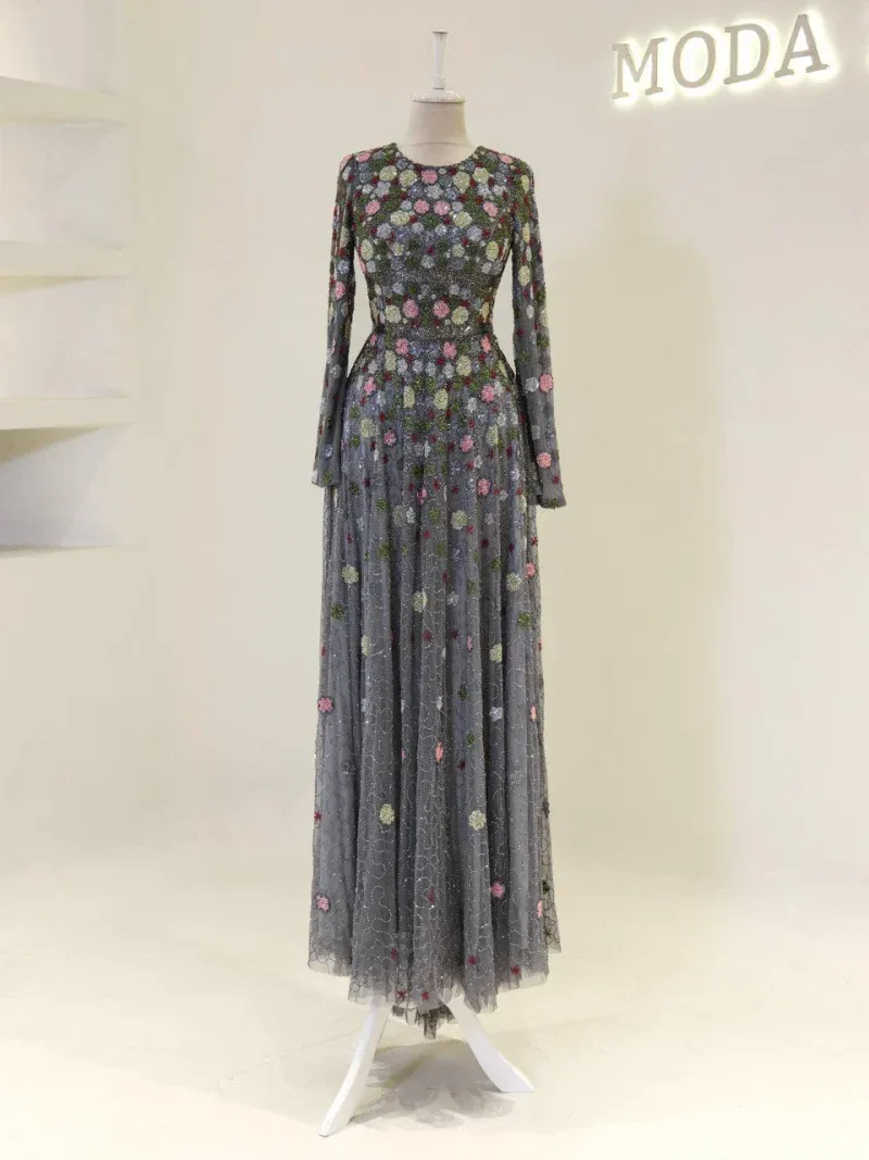 Stylish black floral embroidered maxi dress with long sleeves, perfect for special occasions and elegant events.