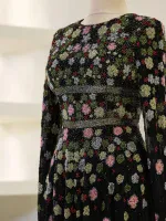 Stunning embroidered dress featuring vibrant floral patterns with bead accents, ideal for formal occasions, weddings, and celebrations.