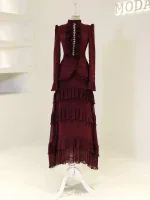 Stylish deep red maxi dress featuring ruffled layers, long sleeves, and intricate detailing, perfect for formal occasions and evening events. Comfortable yet fashionable, available for quick shipping from Turkey.