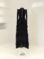 A sophisticated black Victorian-inspired dress featuring ruffled details, long sleeves, and layered pleated skirt, perfect for formal occasions or themed events.