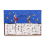 Delicious Turkish delight sweets with powdered sugar, presented in a luxurious blue box featuring whimsical illustrations and the "Harem Chocolate" brand logo. Perfect gift or treat.