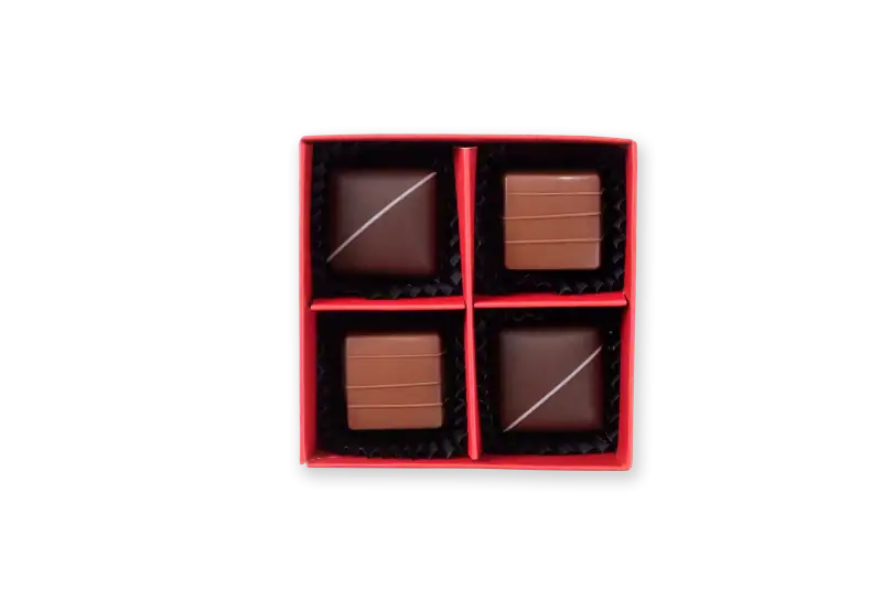 Delicious assorted chocolates in a red gift box with four pieces, top view, high quality, perfect for gifting from Turkey.
