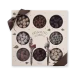 Assorted Turkish delight chocolates gift box with a decorative illustration and a brown bow on top.