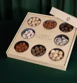 1. Assorted gourmet Turkish chocolates in elegant gift box, including salted hazelnut, pistachio, cashew, strawberry, and black raisin varieties for premium sweet tasting experience.