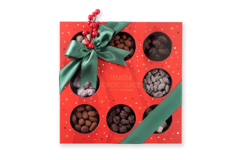 Assorted Turkish chocolates gift box with a green satin ribbon and decorative red berries, perfect for holiday celebrations from Shop of Turkey.