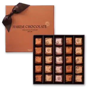Rich assortment of Harem Chocolate individually wrapped in elegant gold, silver, and bronze foil with a luxurious box, perfect gift for chocolate lovers.