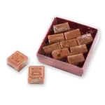 Luxurious Turkish caramel chocolates in a festive gift box decorated with a clock and New Year’s message, perfect for celebrations and gifting from Turkey.