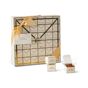 Luxurious gift box of Turkish Harem Chocolate with elegant packaging, gold accents, and an open chocolate box revealing delicious chocolates, perfect for gifting or indulging.