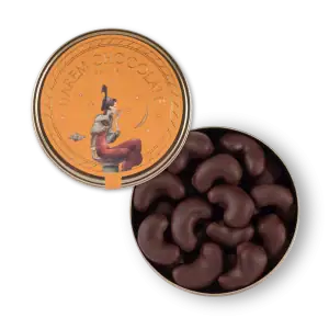 1. Delicious Turkish chocolate candies in a metallic tin on a black background.