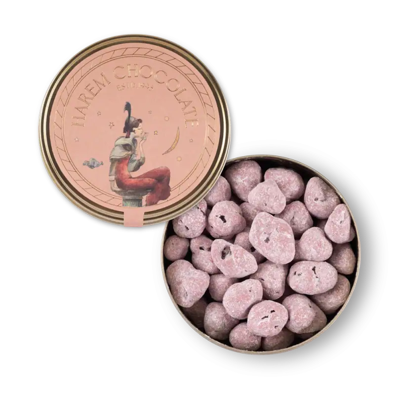 1. Pink Turkish delight candies in an open tin with a whimsical woman illustration on the lid, perfect for authentic Turkish sweets shopping.