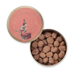 1. Handmade Turkish chocolate truffles in a round tin with decorative pink label featuring an artistic illustration of a woman and celestial elements, perfect for gifting or treats.