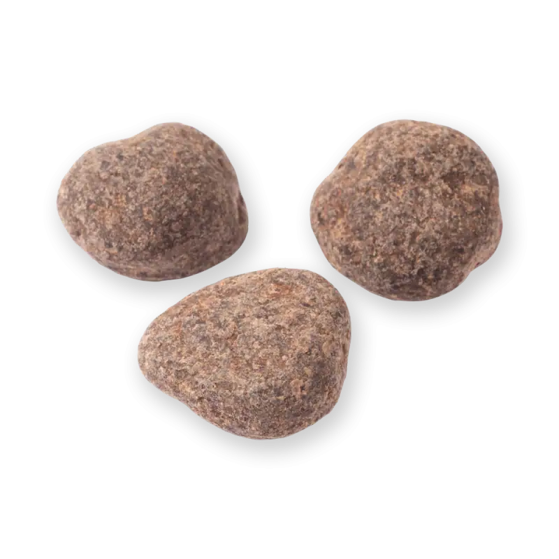 1. Three Turkish volcanic stones with rough texture, brown and gray tones, isolated on black background, showcasing traditional craft materials.