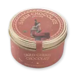 1. Elegant round tin of dried cherry chocolate with vintage artwork and gold accents, perfect for gift-giving or indulging in luxurious Turkish sweets.