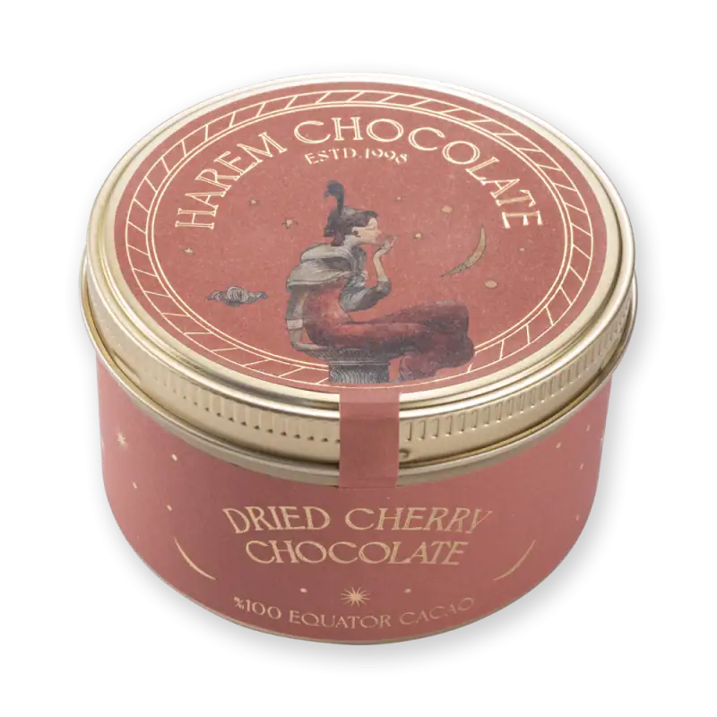 1. Elegant round tin of dried cherry chocolate with vintage artwork and gold accents, perfect for gift-giving or indulging in luxurious Turkish sweets.
