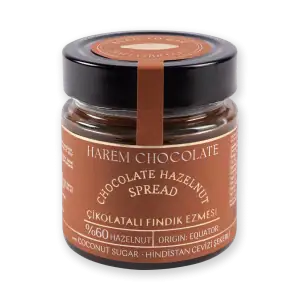 Creamy hazelnut chocolate spread in a small glass jar with black lid, featuring Turkish-origin labeling and natural ingredients, ideal for desserts and breakfast.