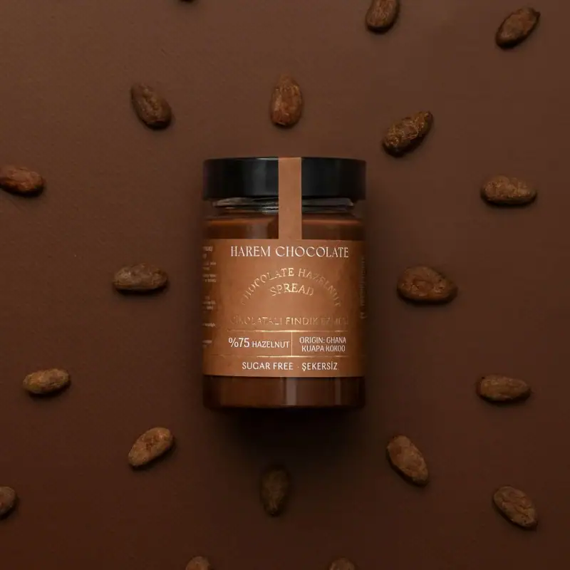 Creamy hazelnut chocolate spread with 75% hazelnuts, made from Ghanaian Kuapa Kokoo cocoa, sugar-free, and perfect for spreading or baking.