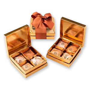 Luxurious gold gift boxes with pistachio treats wrapped in elegant packaging, perfect for gifting from Turkey. Fast worldwide shipping available at Shop of Turkey.