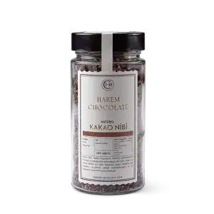 Rich Turkish black cacao nibs in a clear jar with a black lid, ideal for baking and snacking, emphasizing authentic Turkish chocolate products with fast shipping.