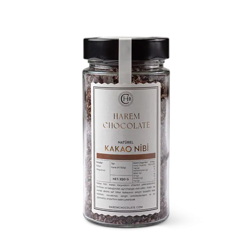 Rich Turkish cocoa nibs in a glass jar with black lid, perfect for baking and snacking, imported from Turkey with fast shipping support.
