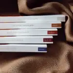 Delicious Turkish cacao pod chocolates in various flavors, including bitter, caramel, and unsweetened, displayed on a textured brown fabric for premium gift options.