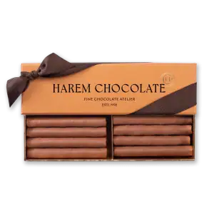 Rich chocolate bars from Harem Chocolate in elegant packaging with a brown ribbon, perfect for gift-giving. Fast shipping from Turkey available.