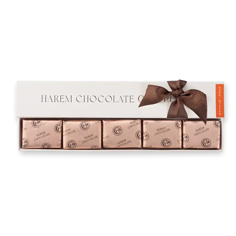 Luxurious dark bitter Turkish chocolate assortment in elegant packaging with a satin ribbon, perfect for gifting or indulging in rich flavors from Turkey.
