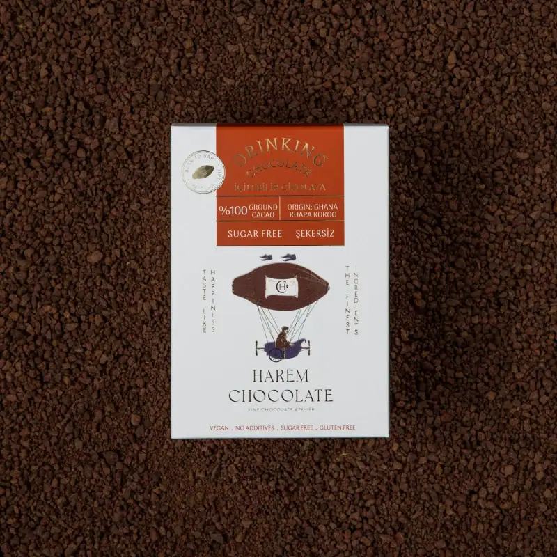 Rich dark chocolate bar on a bed of finely ground cocoa powder, showcasing premium quality and natural ingredients for a luxurious indulgence.