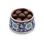Delicious Turkish chocolates in a traditional blue and white porcelain bowl, perfect for sweetening your day with authentic Turkish treats and fast worldwide shipping.