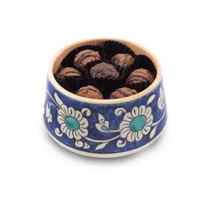 Delicious Turkish chocolates in a traditional blue and white porcelain bowl, perfect for sweetening your day with authentic Turkish treats and fast worldwide shipping.