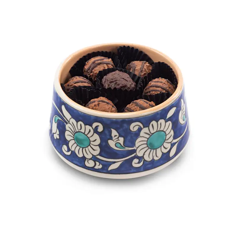 Delicious Turkish chocolates in a traditional blue and white porcelain bowl, perfect for sweetening your day with authentic Turkish treats and fast worldwide shipping.