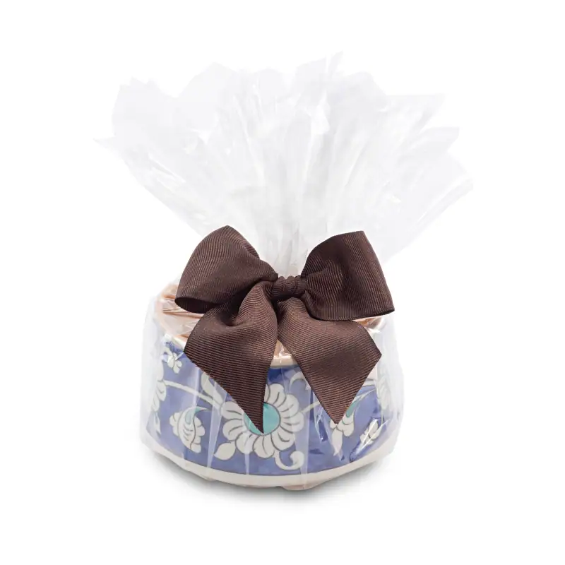 Vibrant Turkish ceramic bowl wrapped in clear plastic with a elegant brown ribbon bow, perfect for authentic Turkish gifts or decor from Shop of Turkey.
