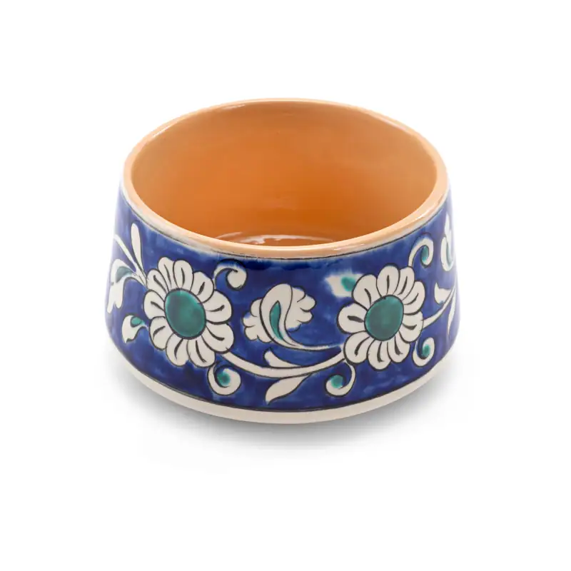 Colorful Turkish ceramic bowl with floral patterns, perfect for traditional serving or decorative purposes. Handcrafted in Turkey with vibrant blue, white, and green details.