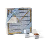 1. Elegant Turkish chocolate gift box with blue ribbon and gold accents, perfect for special occasions and international gifting from Turkey.