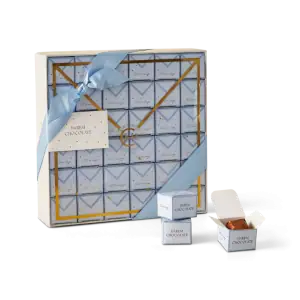 1. Elegant Turkish chocolate gift box with blue ribbon and gold accents, perfect for special occasions and international gifting from Turkey.