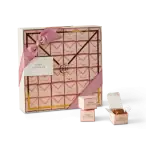 Deluxe pink and gold pastry box with Harem Chocolate treats, elegant ribbon, and individual chocolates, perfect for gifting or special occasions.