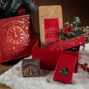 Luxurious Turkish chocolate gift set with holiday-themed packaging, chocolates, and festive decorations, perfect for Christmas and New Year celebrations from Shop of Turkey.