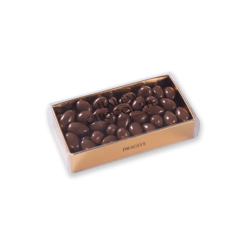 Creamy milk chocolate bonbons in a luxurious gold and clear box, perfect for gifting or indulging. Shop now for authentic Turkish chocolate with fast shipping from Turkey.
