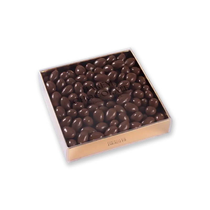 Dark chocolate almonds in clear box with "Harrem Chocolate" branding, luxurious gift packaging, premium confections from Turkey.